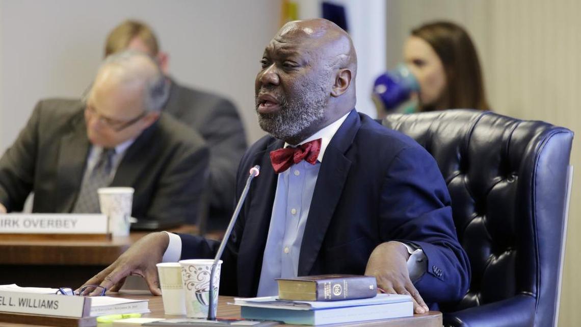 Outgoing Texas Education Commissioner Michael Williams addresses the Texas Board of Education on Wednesday in Austin. Williams has urged the board to keep state testing and academic accountability standards high.