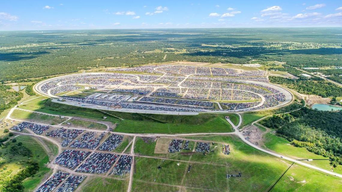 Thousands of cars take up temporary quarters at the Texas World Speedway in College Station in this drone-captured snapshot.