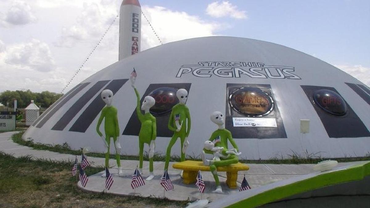 Aliens outside the Starship Pegasus along I-35 south of Dallas.