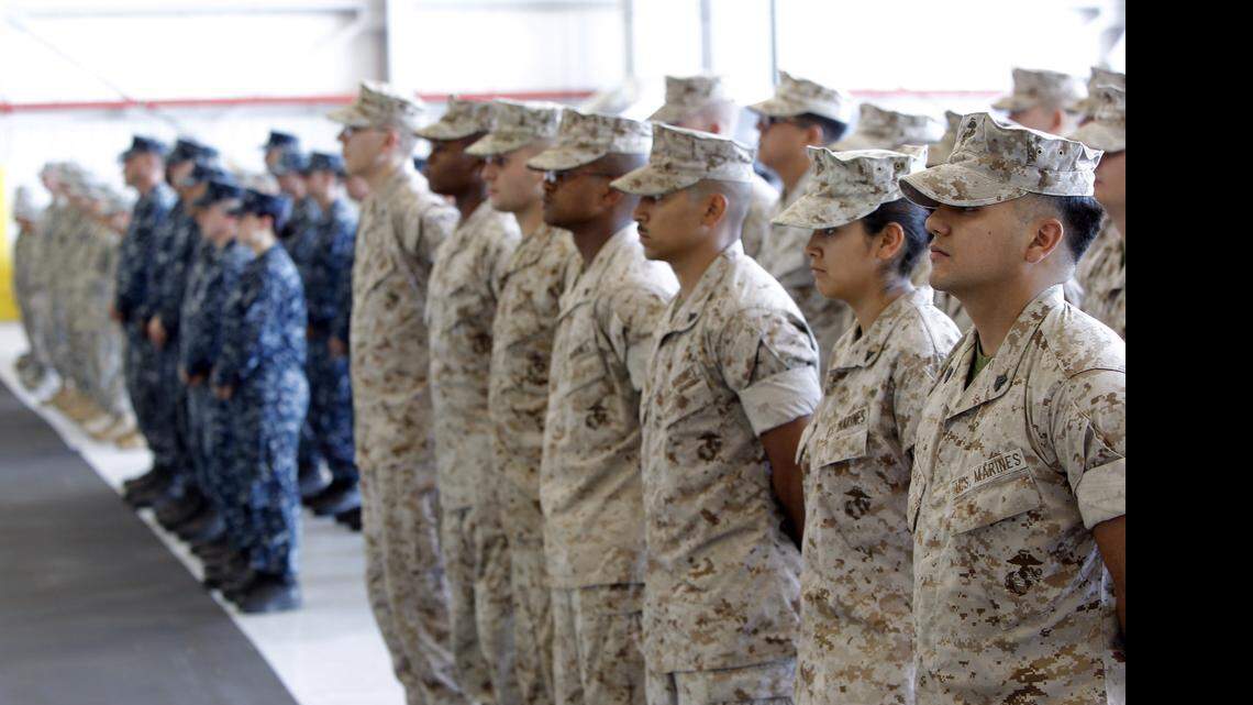 
Service members of the Marines, Navy, Army and Air Force stand at ease during the 20th anniversary celebration at the Naval Air Station Joint Reserve Base in Fort Worth on Monday, October 6, 2014. Special/Brandon Wade
