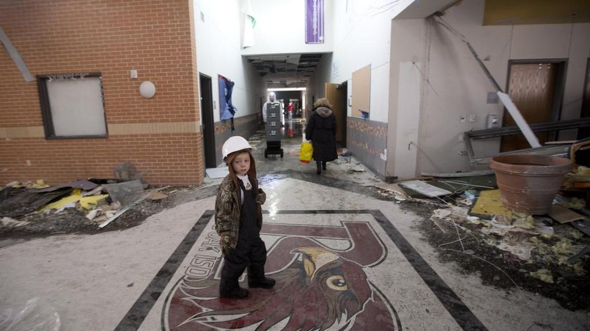 Jake Trice looks through the rubble of his third grade classroom at Donald T. Shields Elementary School in Glenn Heights.