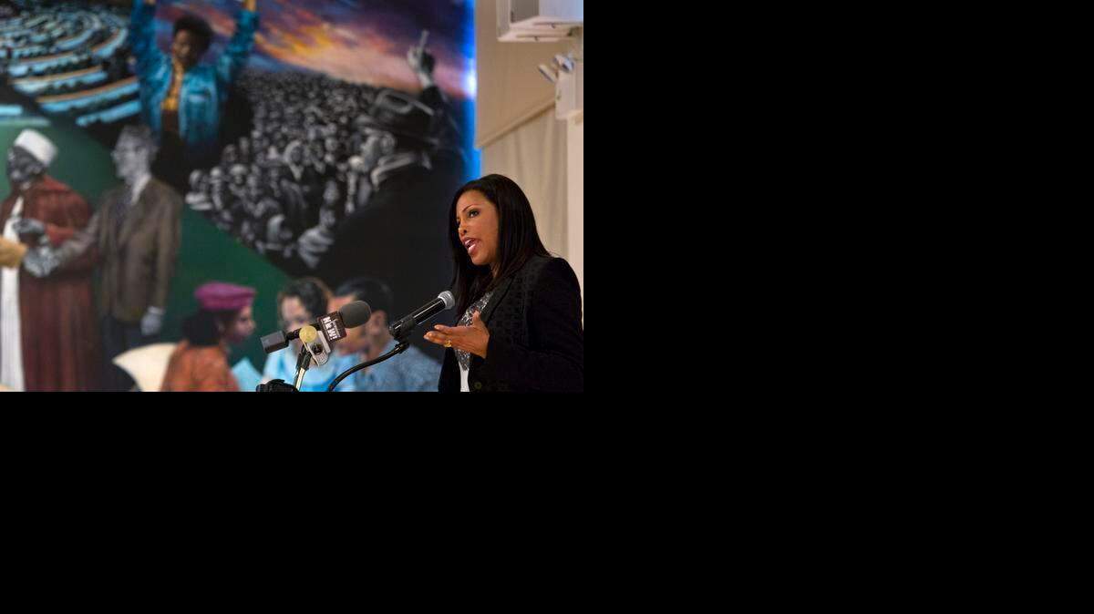 
Ilyasah Shabazz, daughter of Malcolm X, speaks about her father at a memorial Saturday in Harlem. 
