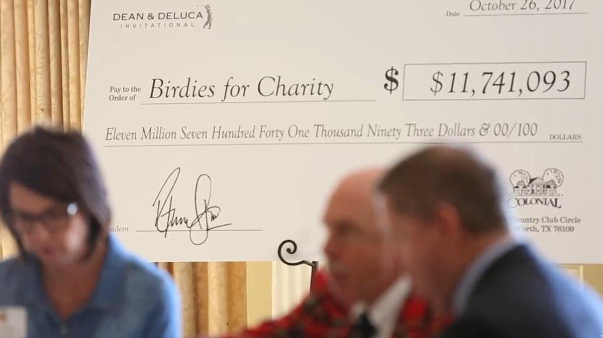The “check” presented Thursday shows total charity money raised through Colonial.
