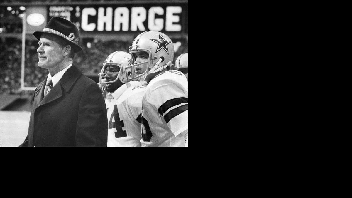 The Cowboys’ “fight song” includes a trumpet Charge fanfare. Coach Tom Landry, Robert Newhouse and Butch Johnson are shown here at a 1978 game.