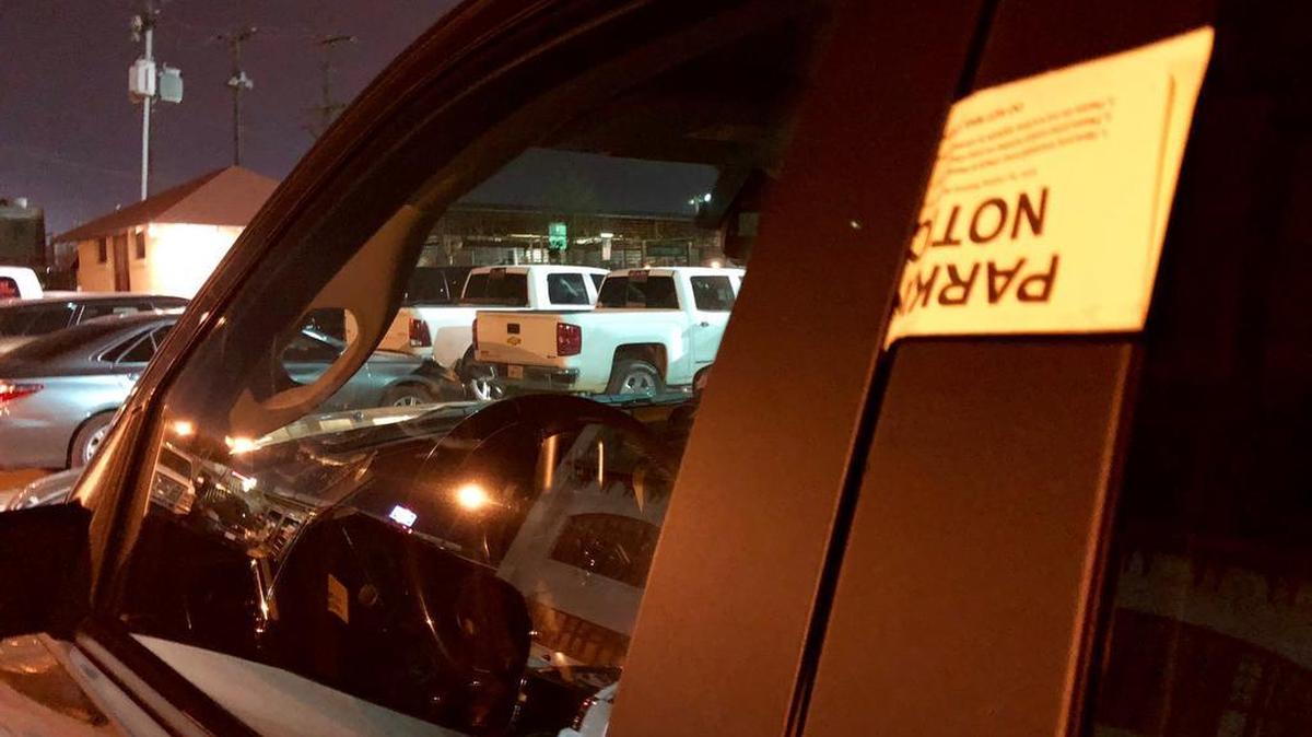 The yellow “parking notices” from a Colorado-based collection agency look somthing like tickets.