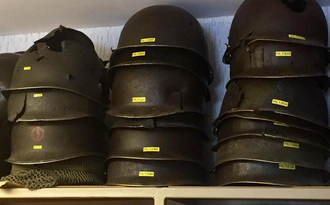Historian Henri Levaufre’s collection of war artifacts includes helmets left behind, many cracked or pierced by weapons fire.