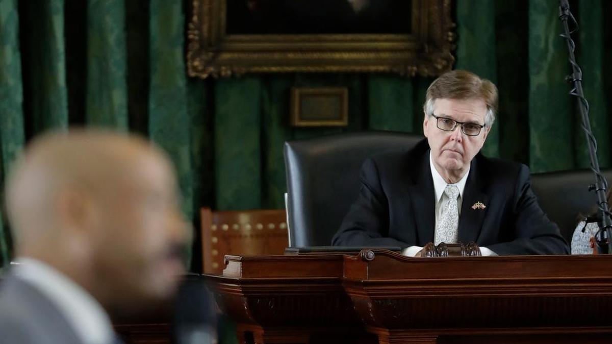 Texas Lt. Gov. Dan Patrick, right, listens to Sen. Borris Miles, D-Houston, during debate over a "bathroom bill" in the Senate Chamber Tuesday.