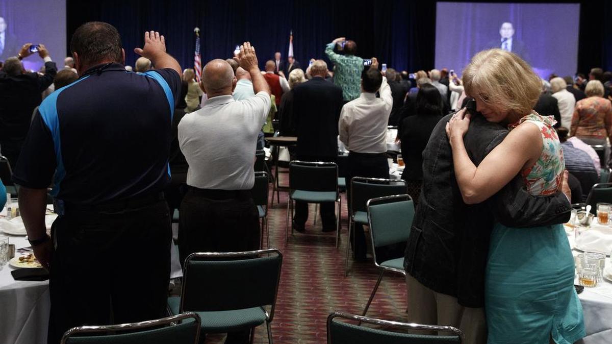 Pastors pray during an event with Republican presidential candidate Donald Trump at the Orlando Convention Center Thursday.