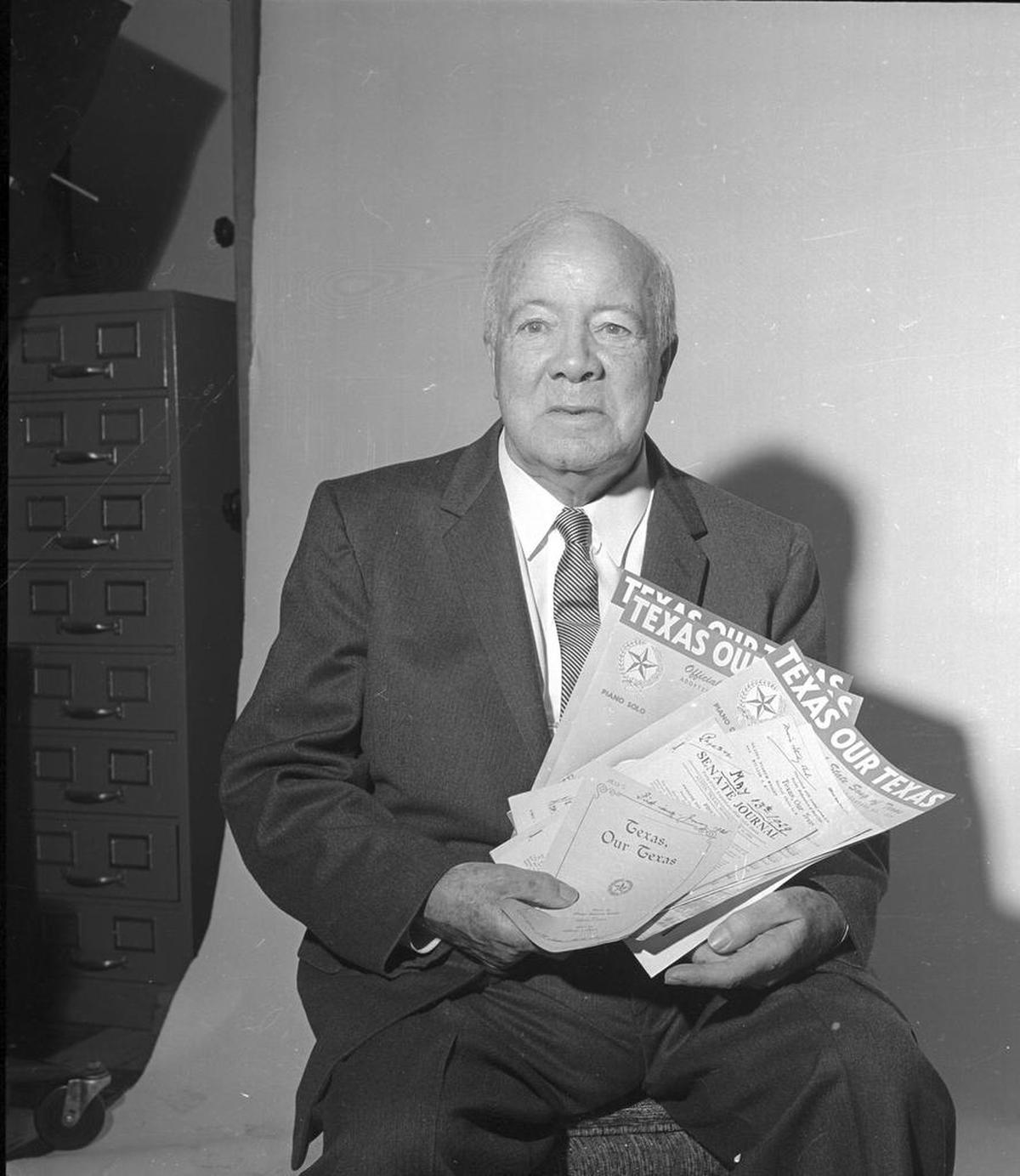 Fort Worth church organist William J. Marsh holds copies of“Texas, Our Texas,” before a 1962 party in his honor at Casa Mañana. Marsh composed the melody.