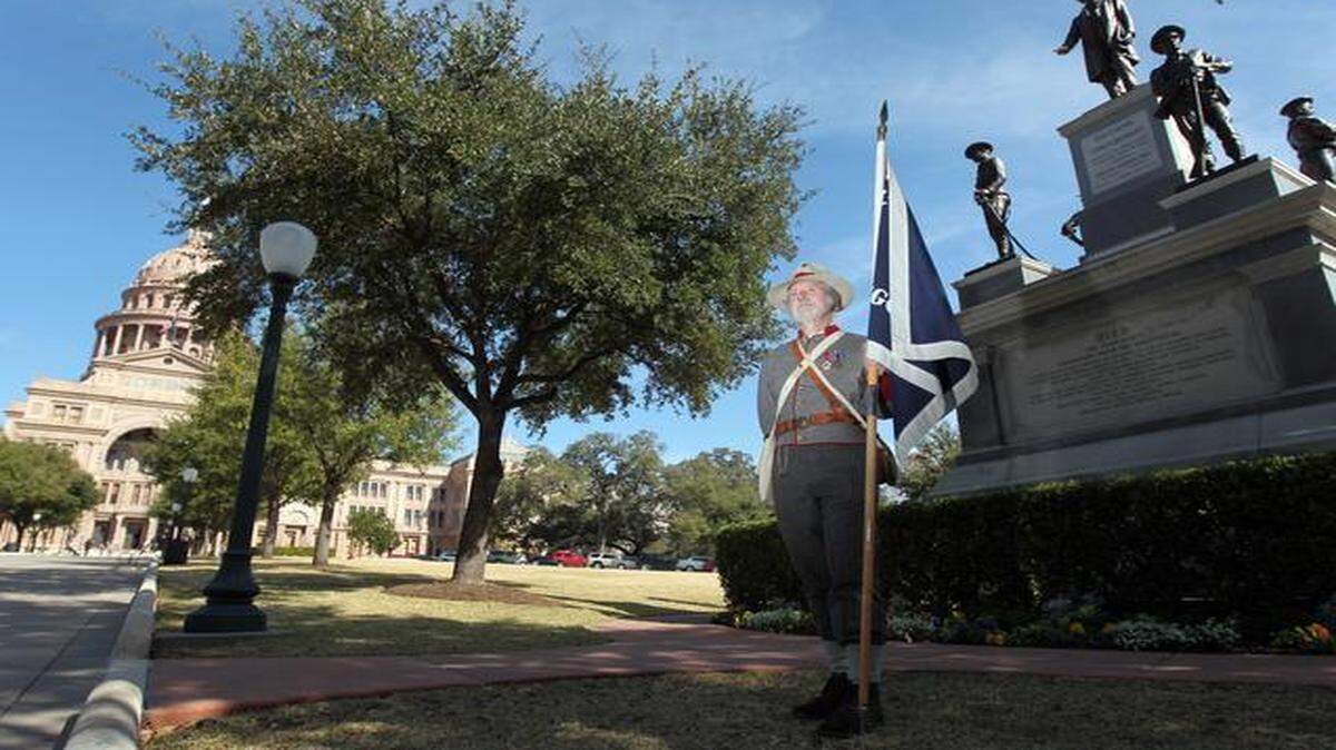 
Shelby Little of Georgetown wears an early Confederate Uniform in front of the Confederate Monument at the Texas State Capitol on Confederate Heroes Day in 2011. His great-grandfather fought for the Confederacy in Alabama. 
