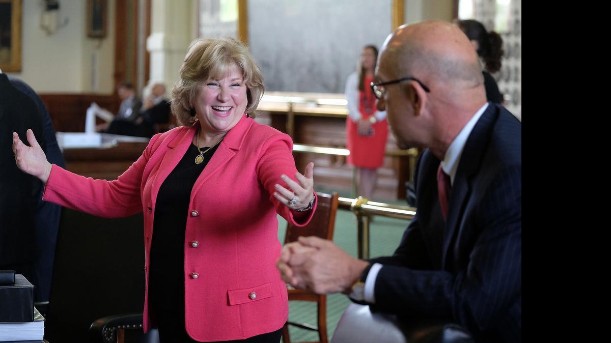 
State Sen. Jane Nelson, R-Flower Mound, chair of the Finance Committee, celebrates after a preliminary budget bill was passed April 14.
