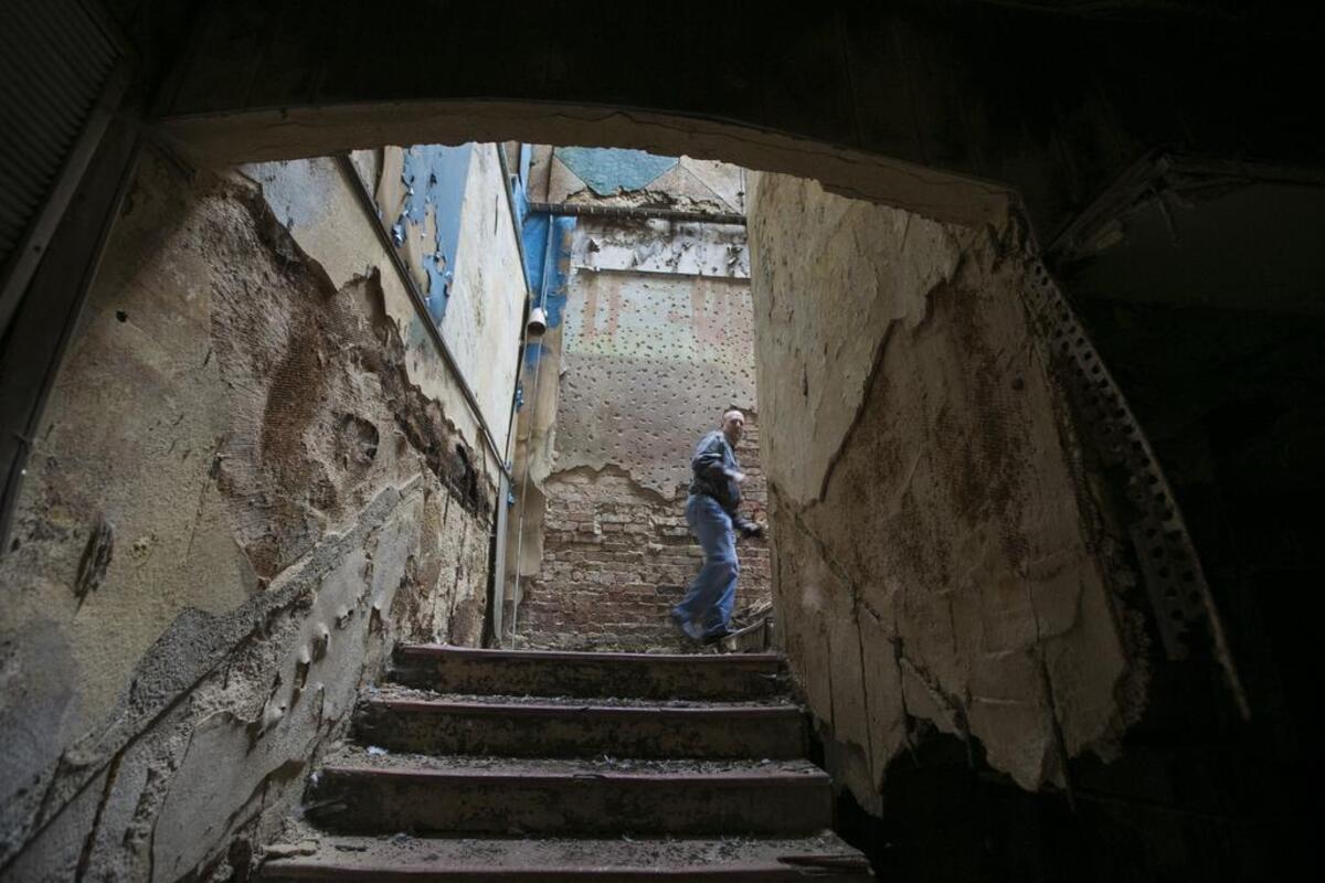 New owner Jeffrey S. Smith walks up the stairs to the balcony in 2017.