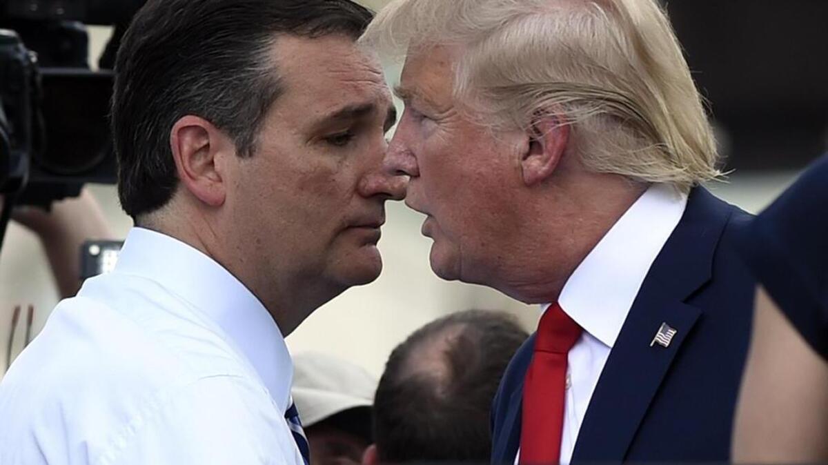 
Sen. Ted Cruz and New York Republican Donald Trump share a word during a rally against the Iran nuclear deal Wednesday in Washington.
