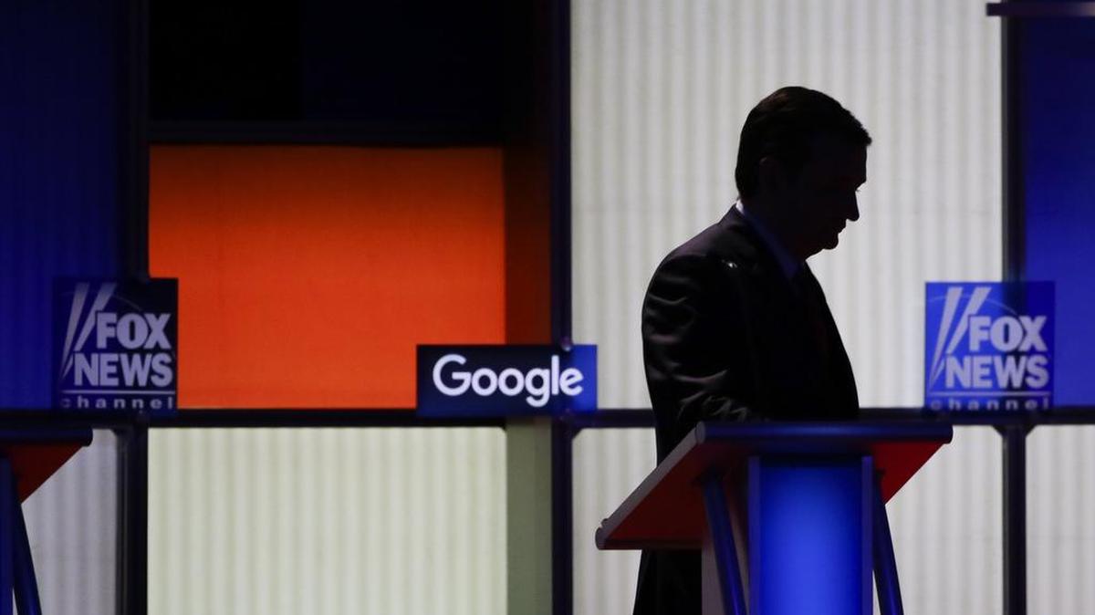 Sen. Ted Cruz walks off alone after the debate Thursday in Des Moines.