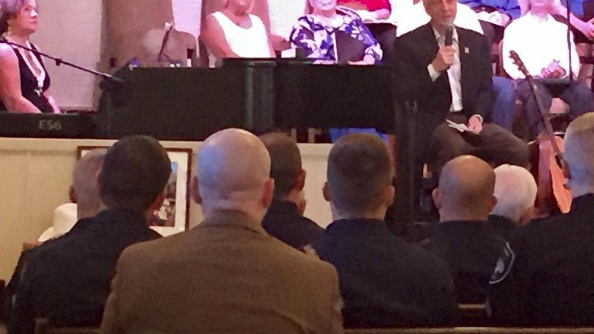 Gordon England speaks before Benbrook first responders Sunday at Western Hills Baptist Church.