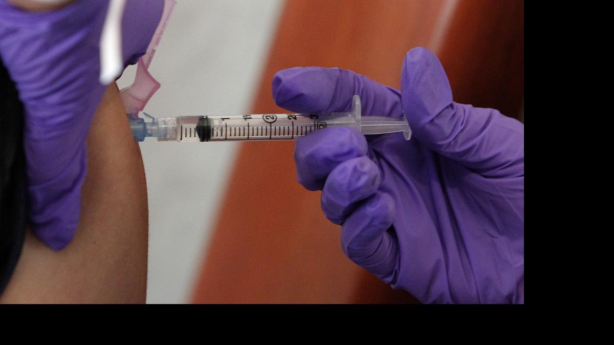 
UNT Health Science Center nurse Mindy Ford gives a Carter-Riverside High School student a free meningitis shot in the medical school’s Pediatric Mobile Clinic 
