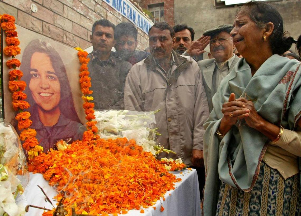 Subesh Chawla, mother of Desi Chawla, a schoolmate of Indian born astronaut Kalpana Chawla, weeps in front of a picture adorned with marigolds during a memorial held at Kalpana’s High school in her home town of Karnal, Haryana, India Sunday Feb. 2, 2003. While Chawla moved from Karnal more than two decades ago she remains a hero to the people who followed her career at NASA that ended with Saturday’s space shuttle catastrophe.