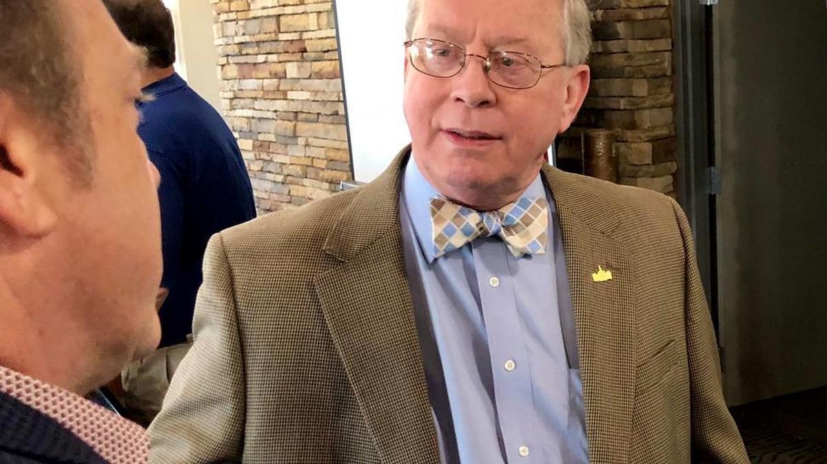Tarrant County Tax Assessor-Collector Ron Wright, right, talks with school board President Aaron Reich,