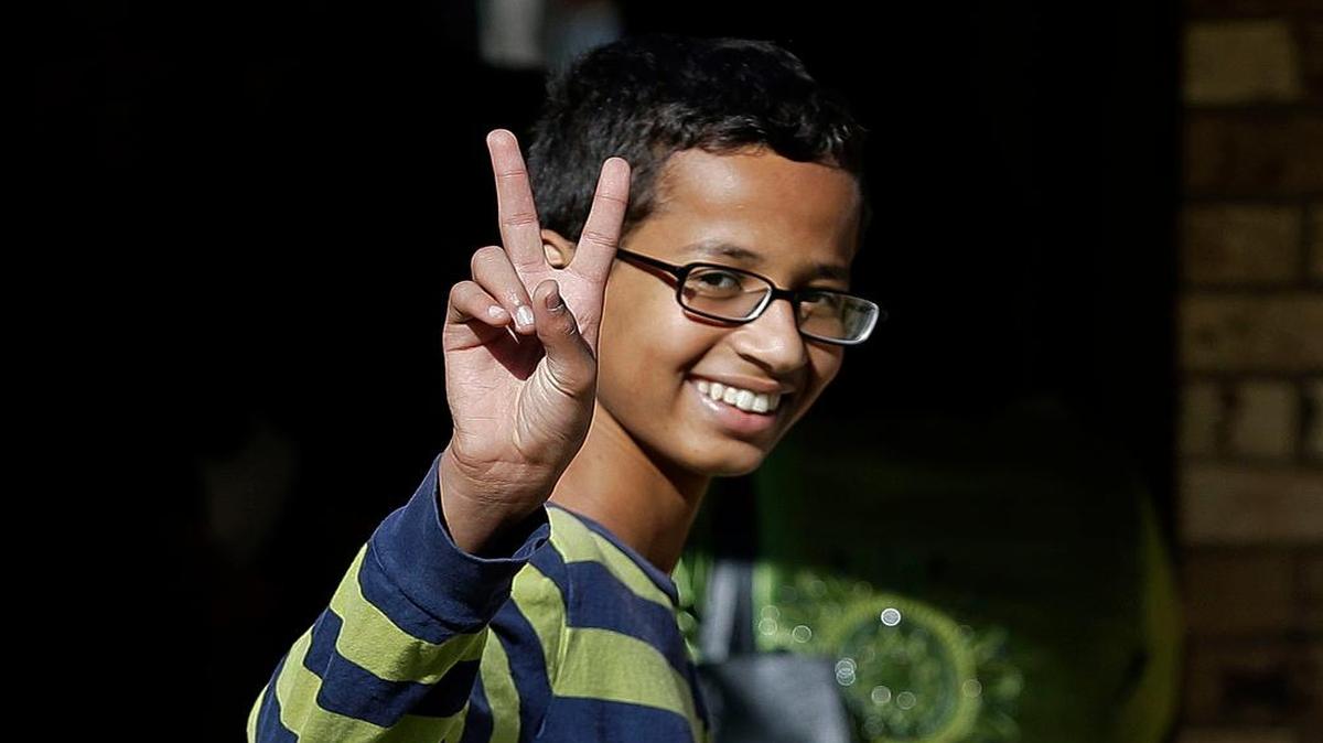 
Ahmed Mohamed, 14, gestures as he arrives at his Irving home on Thursday, Sept. 17, 2015. Ahmed was arrested Monday at his school after a teacher thought a homemade clock he built was a bomb. He remains suspended and said he will not return to classes at MacArthur High School. 
