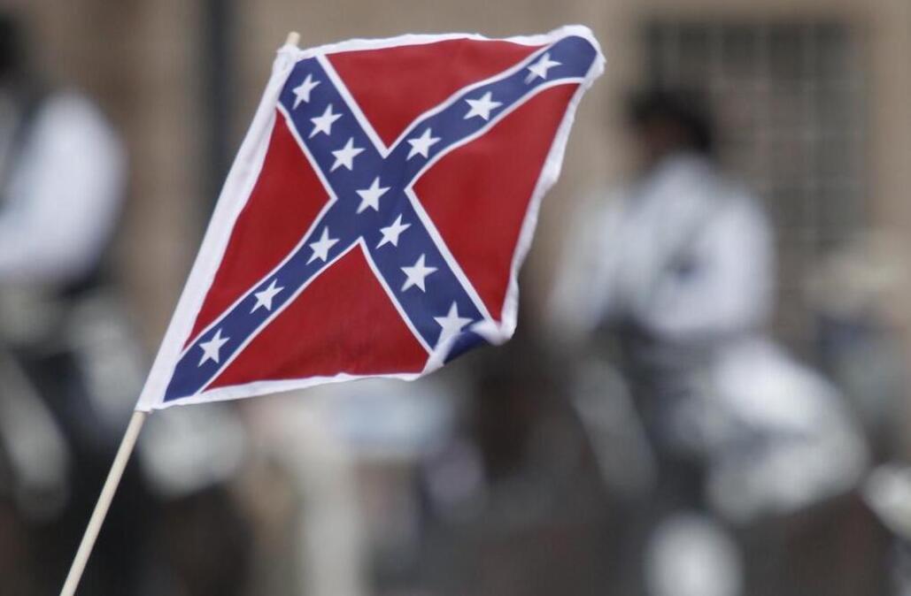 Confederate battle flags were not hard to find among people watching the Fort Worth Stock Show’s All Western Parade on Jan. 16, 2016. Stock Show officials did not allow parade riders to fly the flag.
