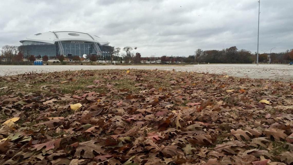 The leaf-strewn Globe Life Parking Lot A is the planned hotel-retail site.