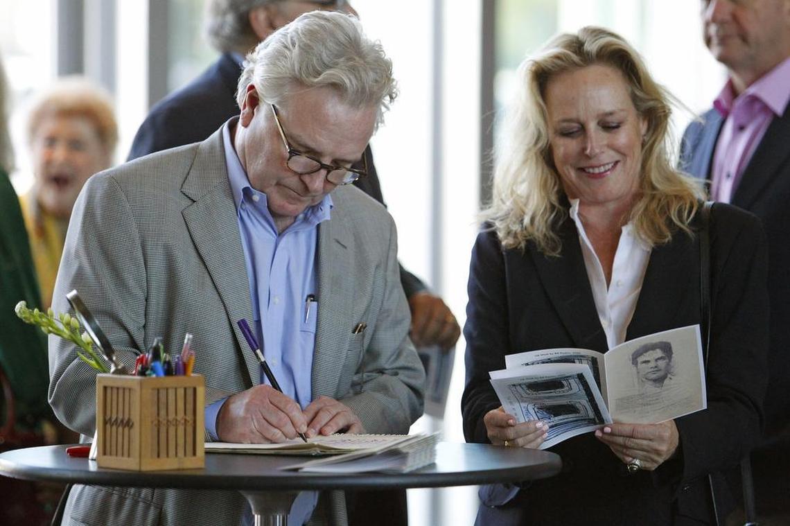 Friends Ed Farmer Beggs and Janie Beggs sign the guestbook for actor Bill Paxton at a tribute at the Modern Art Museum of Fort Worth.