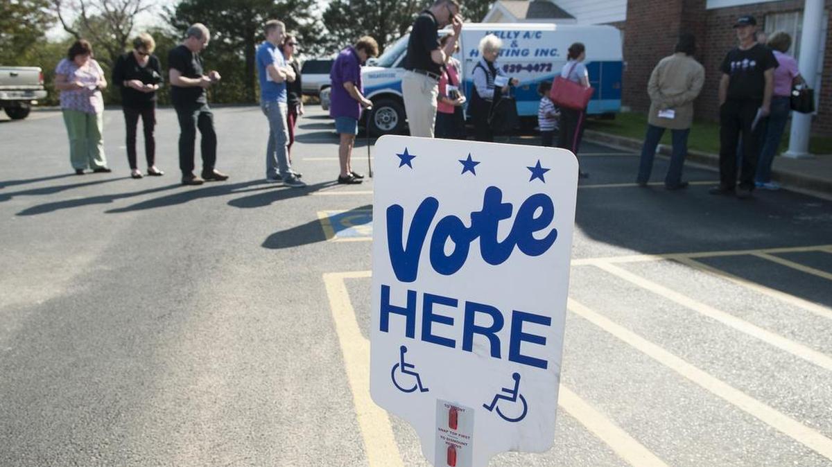Voters line up vote Tuesday in Flint, Texas.