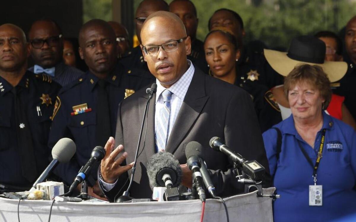
Officers look on as new Fort Worth police Chief Joel Fitzgerald speaks to the media Monday.
