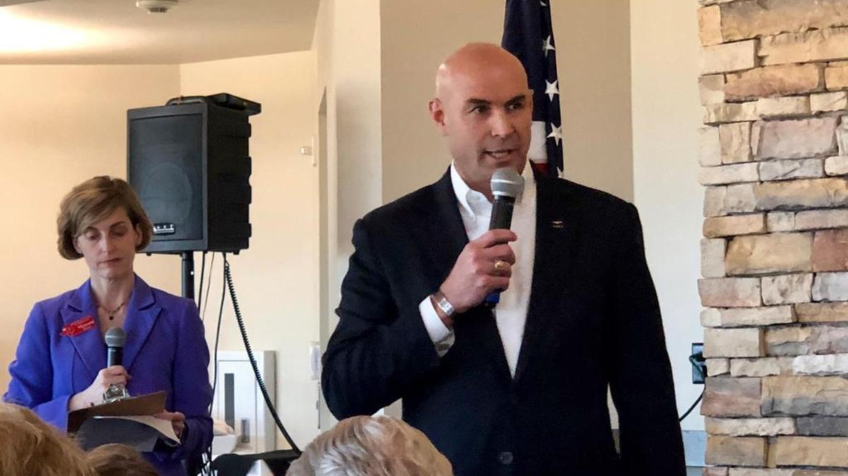 Ellis County Republican Jake Ellzey addresses the Arlington Republican Women’s Club. Moderator Victoria Farrar-Myers is in the background.