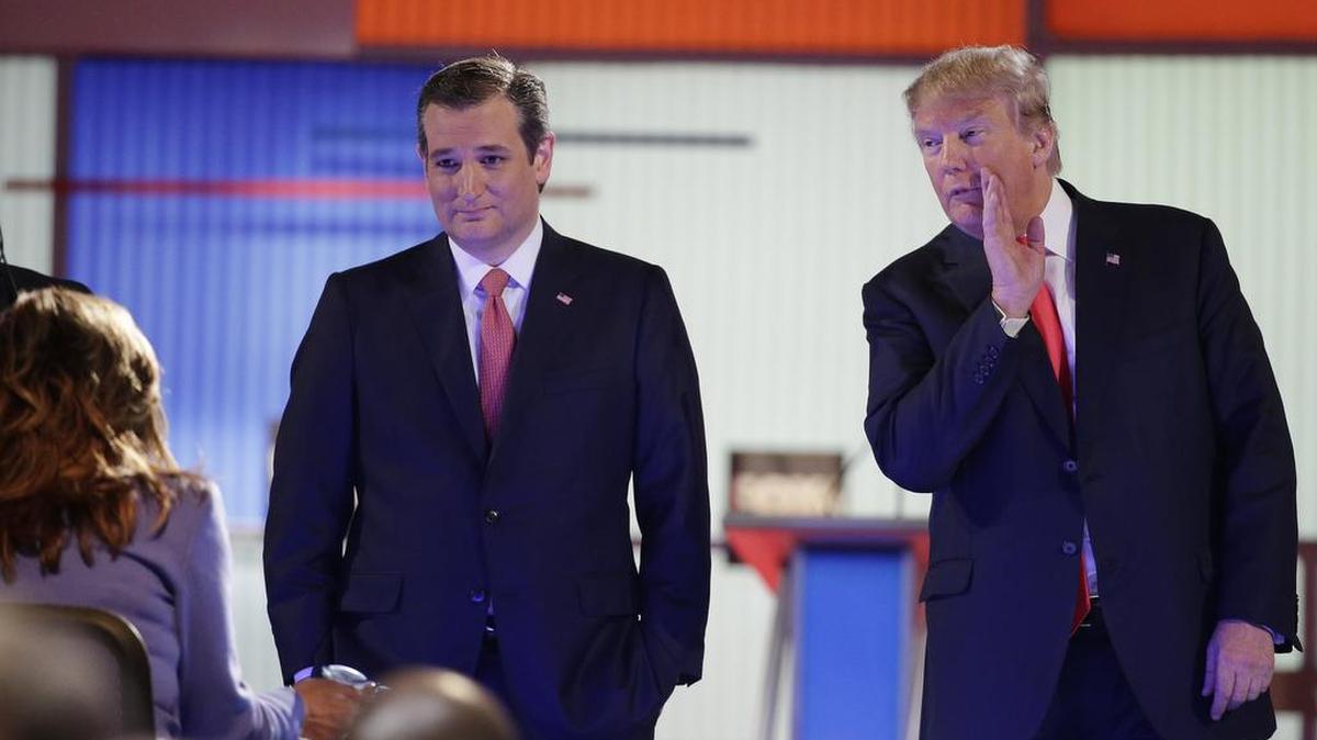 New York Republican Donald Trump speaks with a moderator as U.S. Sen. Ted Cruz, R-Texas, looks on during the Jan. 14 debate in North Charleston, S.C.