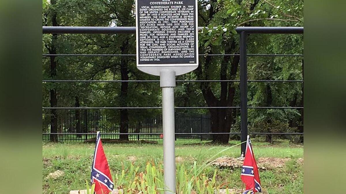 Confederate battle flags fly with a historical marker in an undated photo. The flags were removed by Texas Department of Transportation workers on Tuesday, August 15.