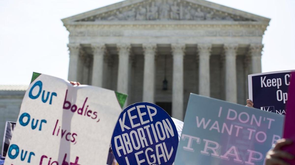The signs of pro-abortion rights demonstrators outside the U.S. Supreme Court.