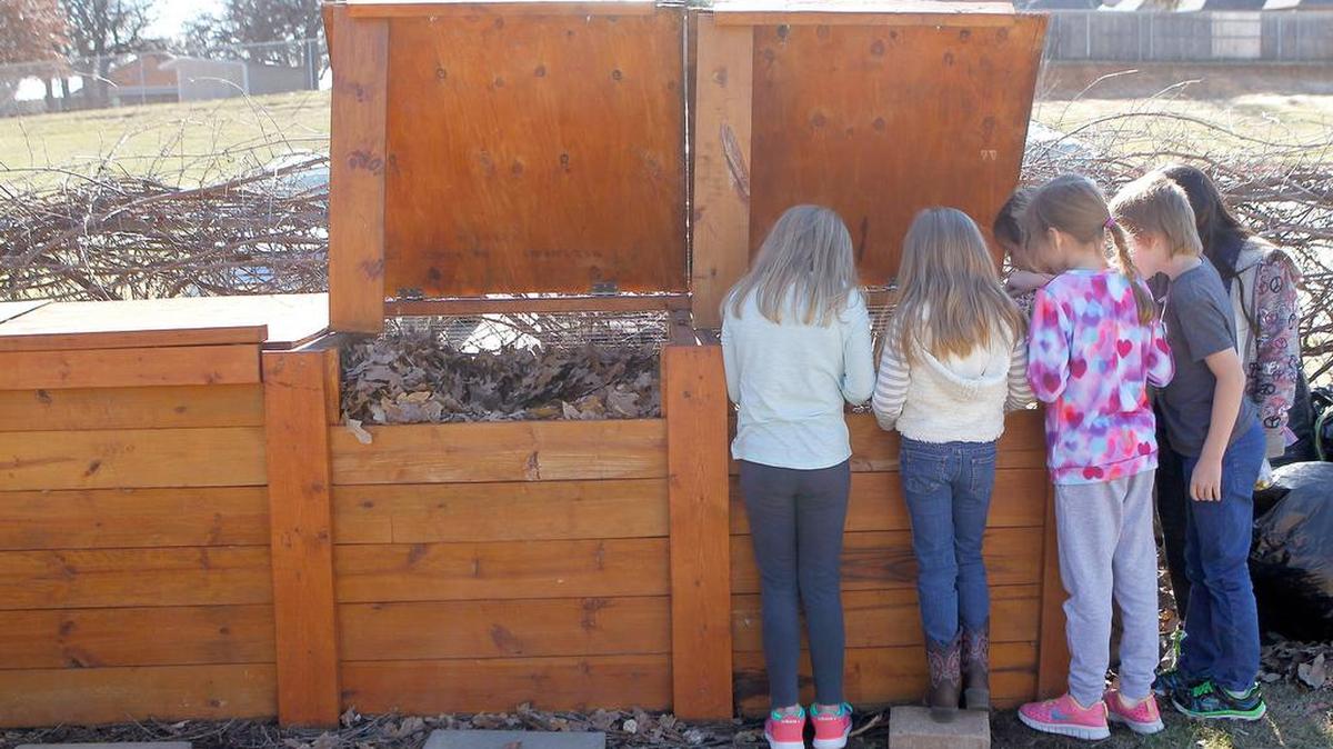 Students check out the compost bins in the Willis Outdoor Learning Facility at Willis Lane Elementary, a Green Ribbon School, in Keller in 2015.