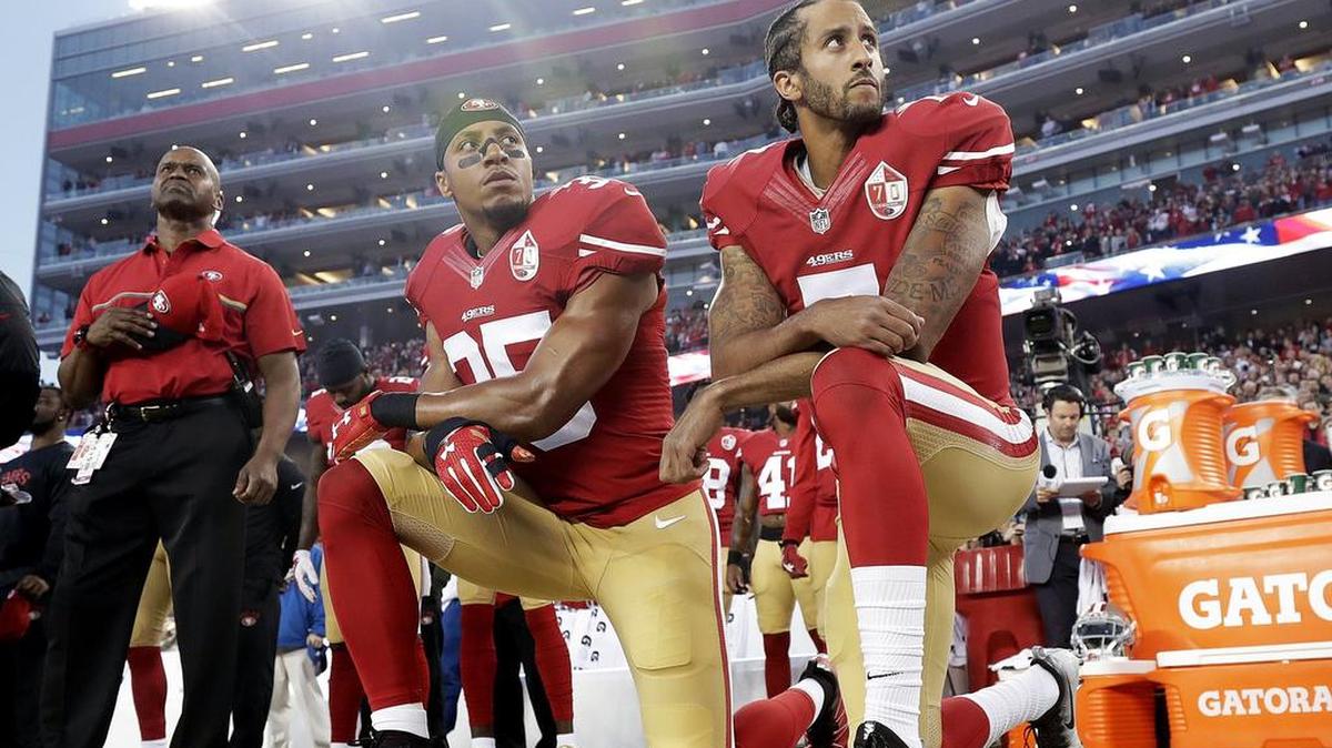 San Francisco 49ers safety Eric Reid (35) and quarterback Colin Kaepernick (7) kneel during the national anthem before an NFL football game against the Los Angeles Rams in Santa Clara, Calif. Reid has resumed his kneeling protest for human rights during the national anthem, after joining then-teammate Kaepernick's polarizing demonstration last season.