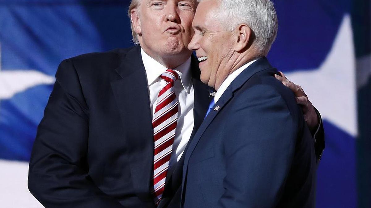 Donald Trump gives running mate Gov. Mike Pence of Indiana a kiss during the Republican National Convention.