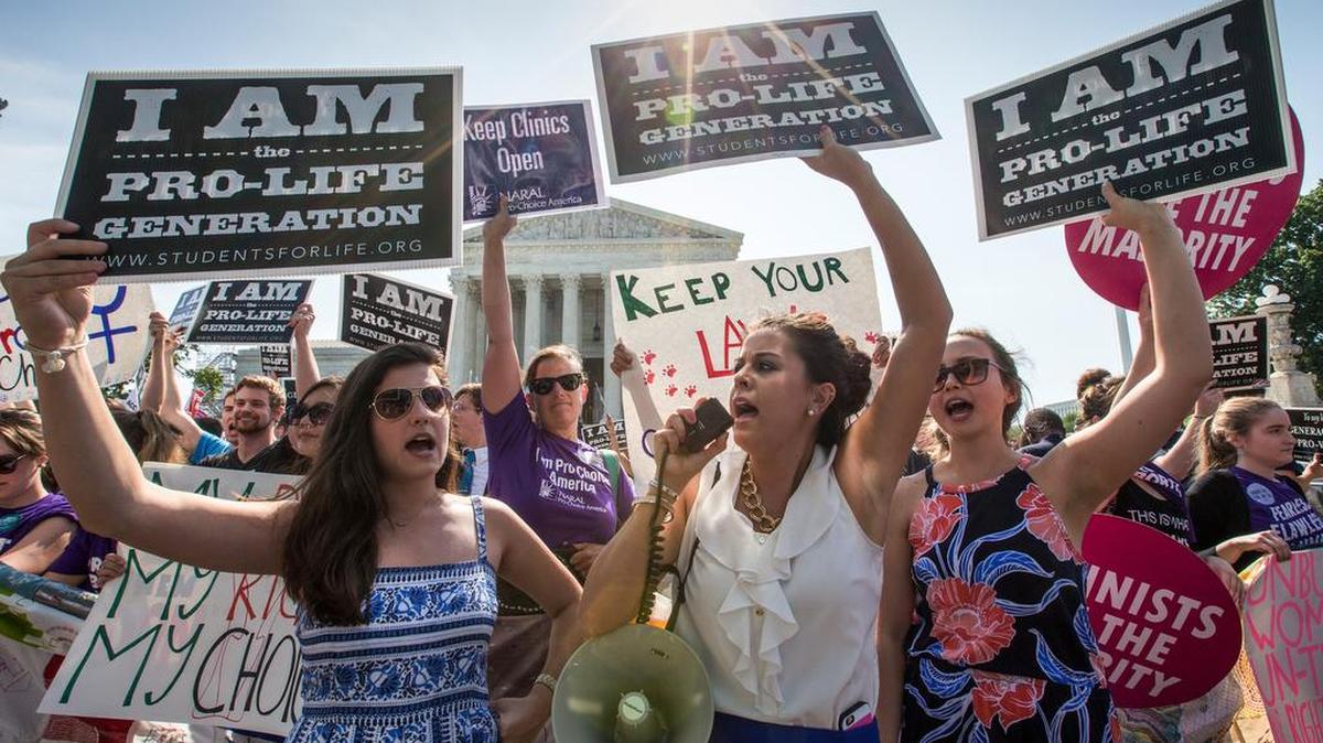 Anti-abortion activists demonstrate June 27 at the Supreme Court in Washington as justices considered previous Texas abortion restrictions.