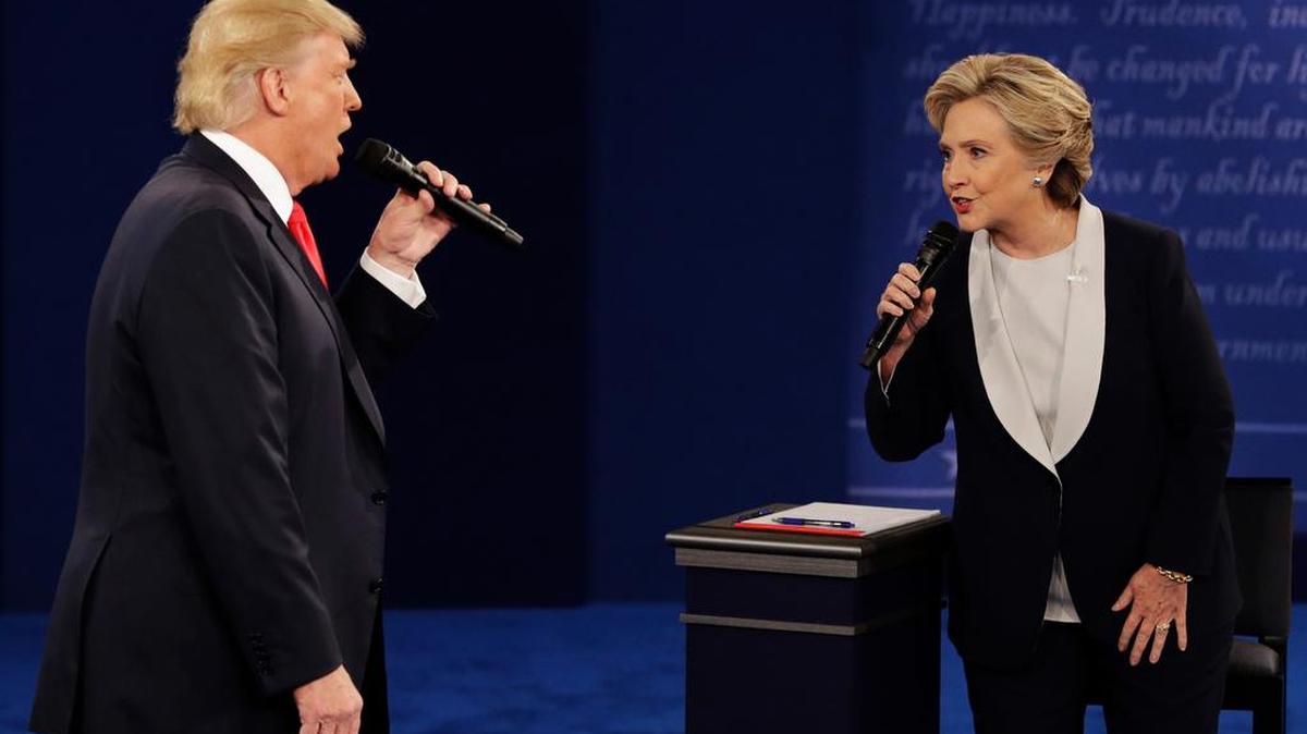 Republican presidential nominee Donald Trump and Democratic presidential nominee Hillary Clinton speak during the second presidential debate at Washington University in St. Louis, Sunday, Oct. 9.