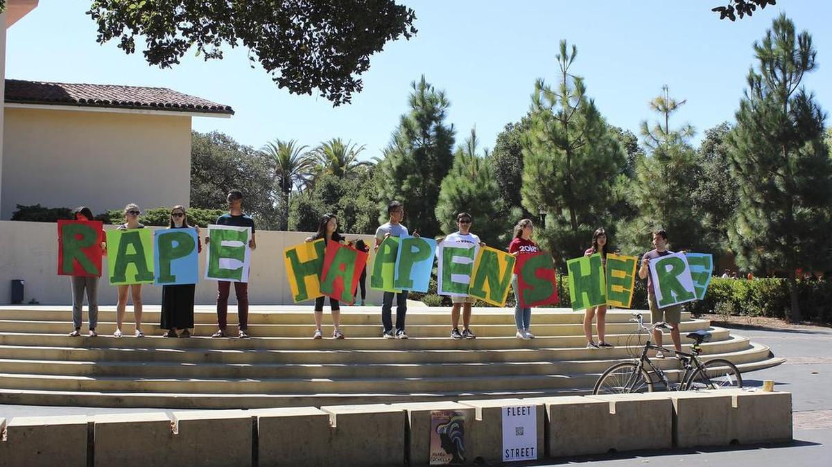Students hold up a sign about rape at White Plaza during New Student Orientation on the Stanford University campus in Stanford, Calif.