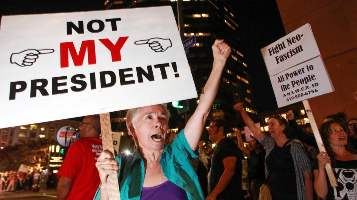 Faith Attaguile of Encinitas, Calif., yells chants Wednesday in downtown San Diego during a protest against Donald Trump's presidential election victory.