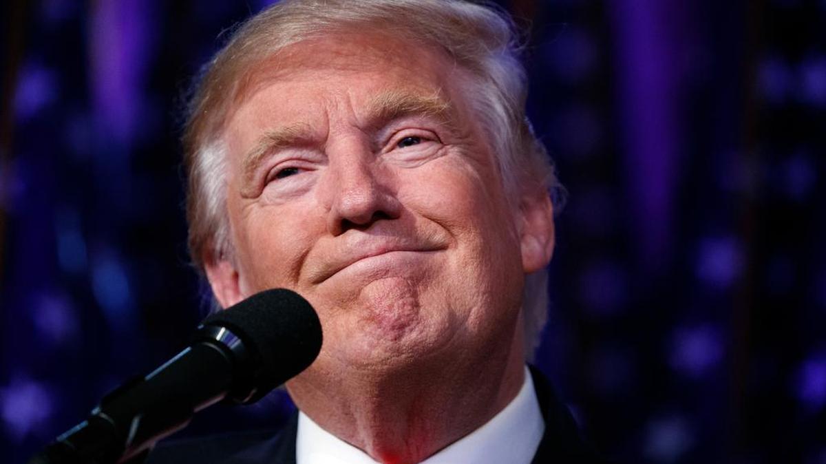 President-elect Donald Trump smiles as he arrives to speak at an election night rally early Wednesday in New York.