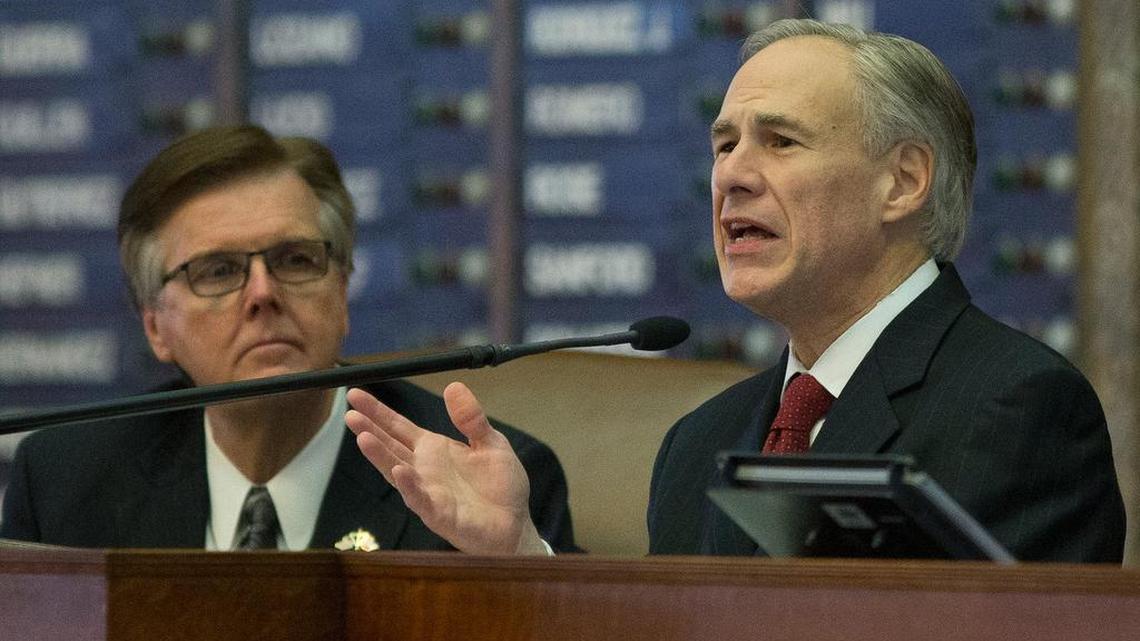 Texas Gov. Greg Abbott, right, speaks to the Legislature Tuesday. At left is Lt. Gov. Dan Patrick.