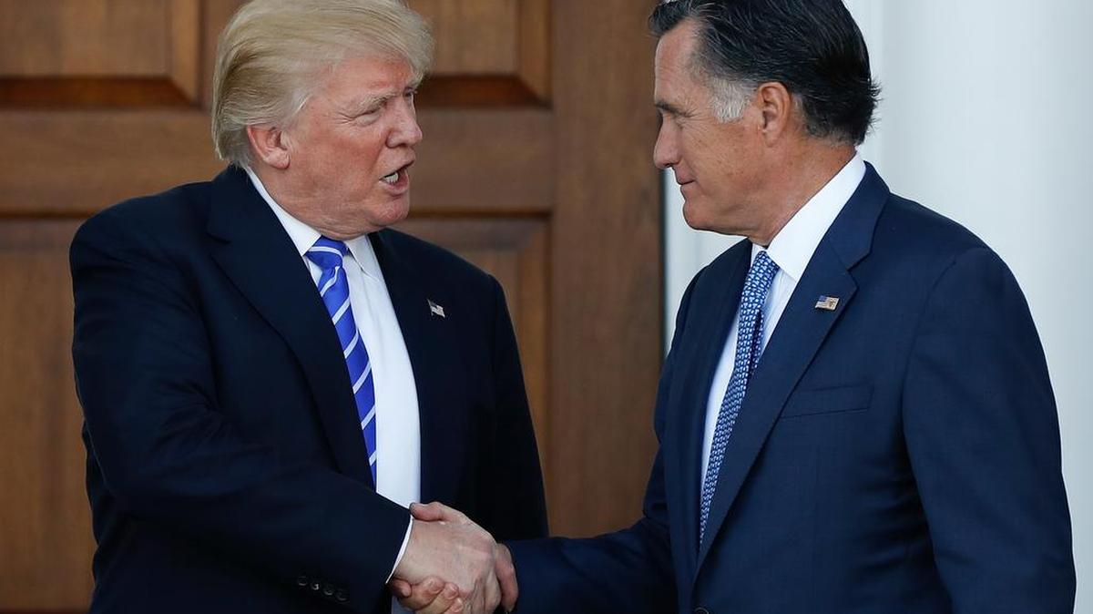President-elect Donald Trump and Mitt Romney shake hands after meeting Nov. 19.