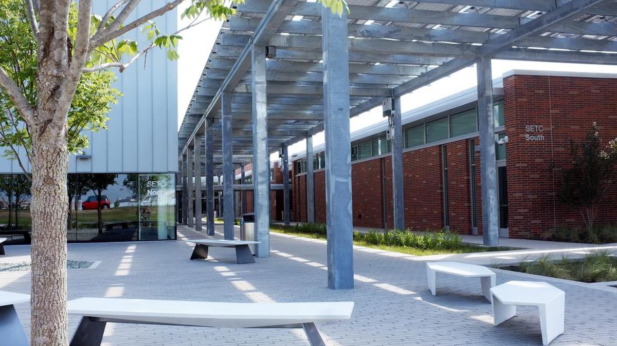 Tarrant County College recently finished construction on its new Center of Excellence for Energy Technology. Students can gather outside the building in courtyards shaded by solar energy arrays that help power the building.