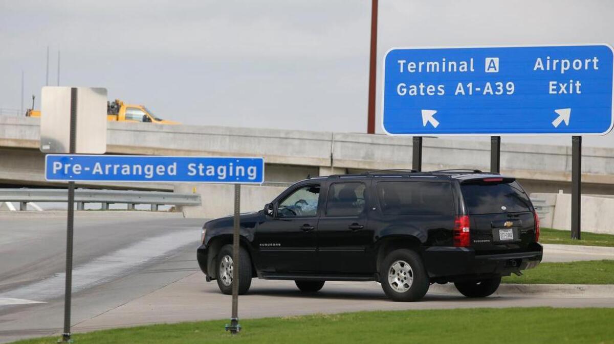An Uber driver leaves the Pre-Arranged Staging lot at Terminal A at DFW International Airport.