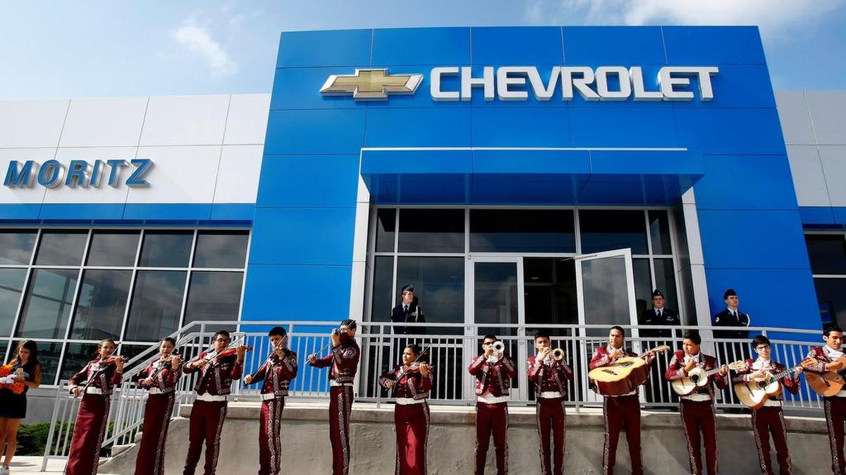 The North Side Mariachi Band performs during the FWISD perfect attendance car giveaway at Moritz Chevrolet in Fort Worth on Wednesday, May 28, 2014.