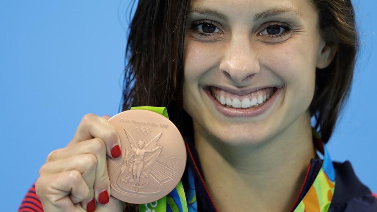 United States' Katie Meili shows off her bronze medal during the ceremony for the women's 100-meter breaststroke final during the swimming competitions at the 2016 Summer Olympics, Tuesday, Aug. 9, 2016, in Rio de Janeiro, Brazil.