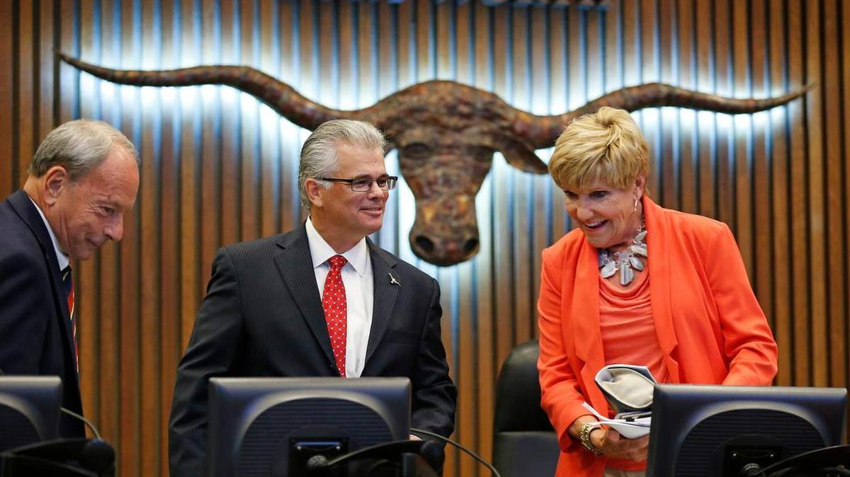
City Manager David Cooke, center, and Mayor Betsy Price, right, in the Fort Worth City Council chambers 
