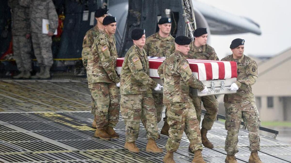 An Army carry team moves a transfer case containing the remains of Sgt. Allen Levi Stigler Jr. at Dover Air Force Base, Del., Tuesday, Aug. 15, 2017. According to the Department of Defense, Stigler, 22, of Arlington, Texas, died Aug. 13, 2017, of wounds sustained while engaged in combat operations in Iraq.