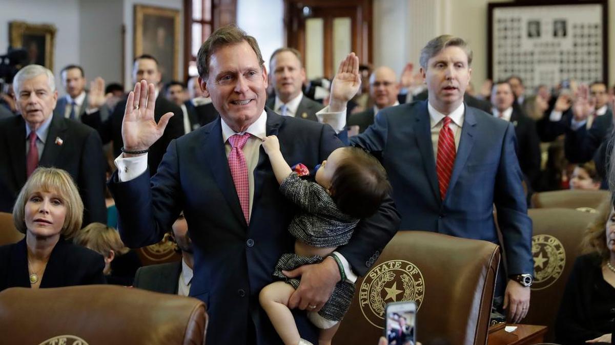 Texas Rep. John Zerwas, R-Richmond, holds his granddaughter, Tinley, as he and other lawmakers are sworn in during the beginning of the 85th Texas Legislative session at the Texas Capitol on Jan. 10 in Austin.