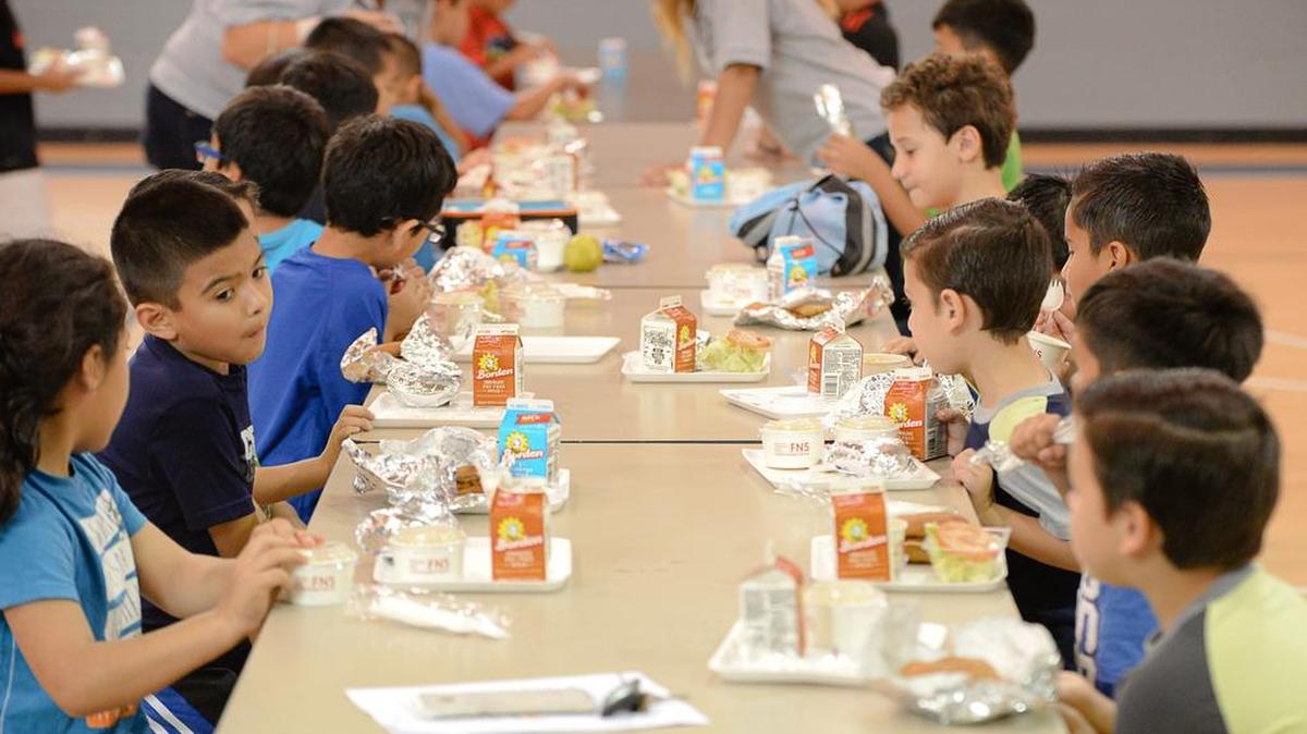Children enjoy lunches provided by the Brownsville Independent School District on Wednesday, June 8, 2016, at the Olivera Park gymnasium in Brownsville, Texas. The local school district provides free lunches to any child under 18 who needs a meal, regardless of their status as a student with the school district.